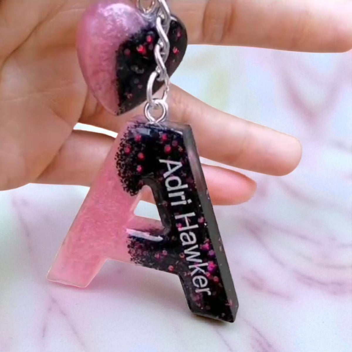 Misty Crafts Designs personalised letter A resin keychain with pink and black glitter finish and heart charm